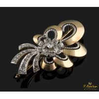 Broche en oro amarillo y oro blanco con un brillantes y diamantes.