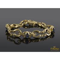 Pulsera realizada en oro amarillo. Presenta zafiros naturales.