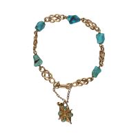 Pulsera en oro amarillo con turquesas.