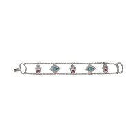 Pulsera en oro blanco con motivos arábigos turquesas y rubíes.
