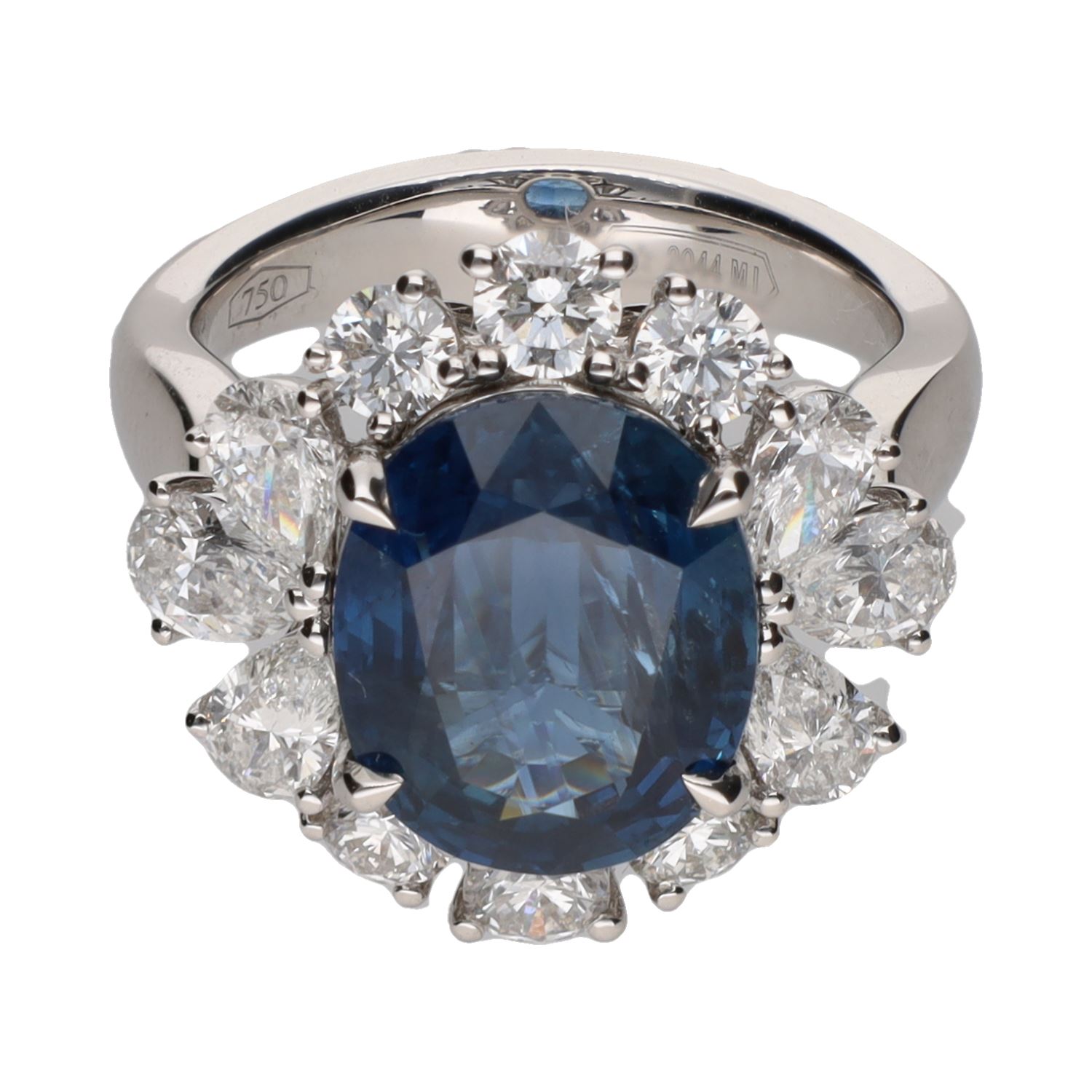 Sortija en oro blanco con zafiro y orla de brillantes. Talla 13.