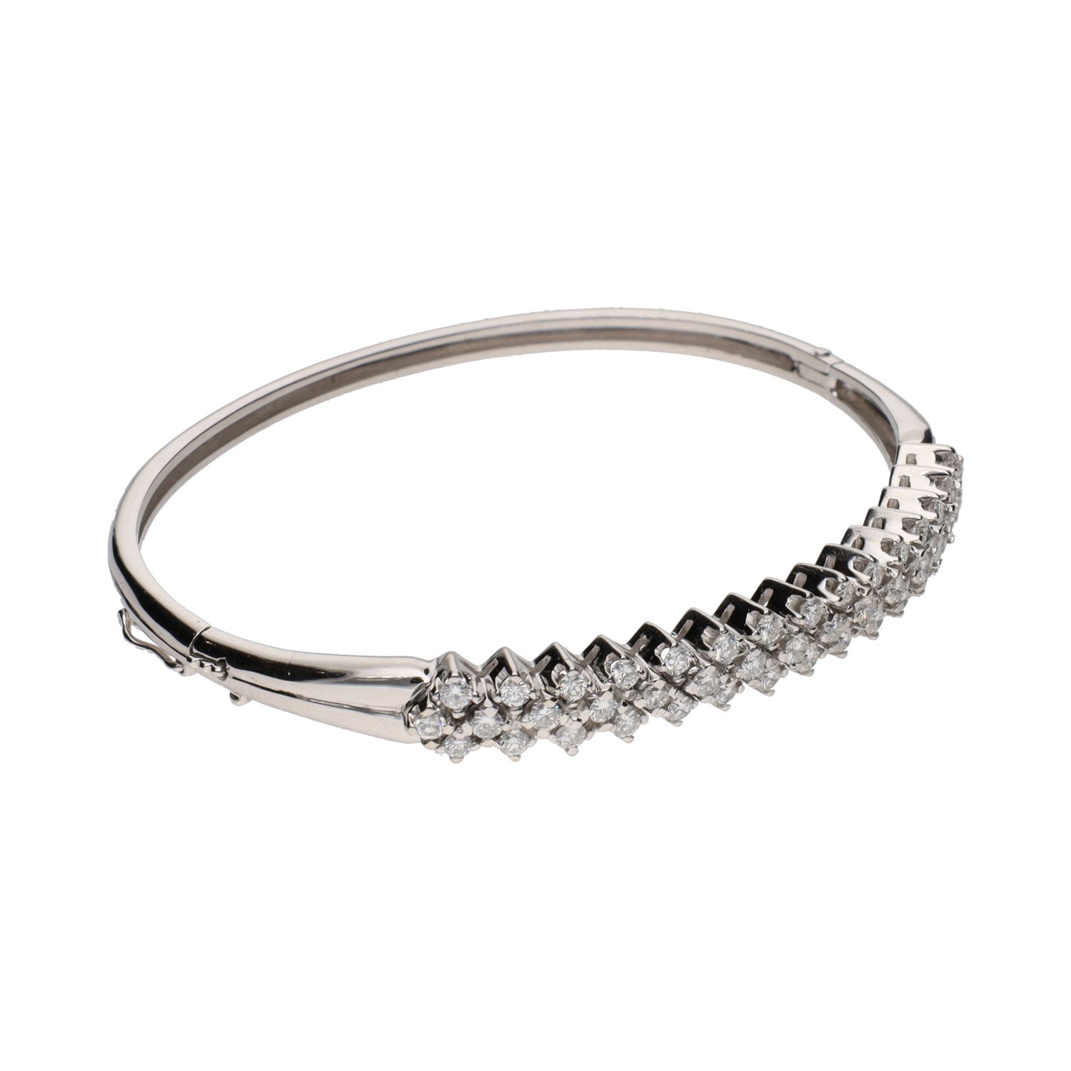 Pulsera rígida en oro blanco con brillantes.