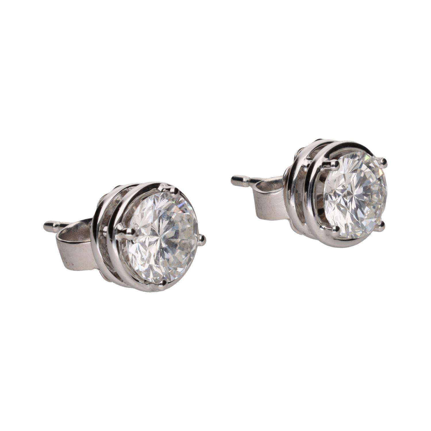 Pendientes dormilonas en oro blanco con brillantes.