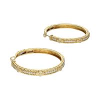 Pendientes argolla en oro amarillo con brillantes.