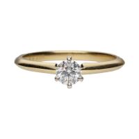 Solitario tiffany & co en oro amarillo con un brillante de 0,32ct. Talla 12.