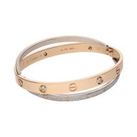 Pulsera love de cartier en oro rosa y oro blanco con brillantes. Talla 17.
