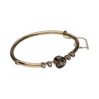 Pulsera rígida antigua en oro amarillo con zafiros y diamantes.