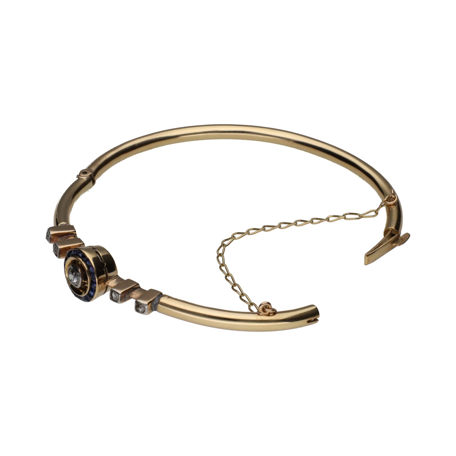 Pulsera rígida antigua en oro amarillo con zafiros y diamantes.