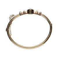 Pulsera rígida antigua en oro amarillo con zafiros y diamantes.