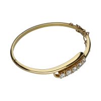 Pulsera rígida en oro amarillo con cinco brillantes.
